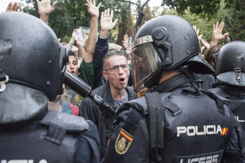 Violence erupts as Catalans vote on referendum on a split from Spain