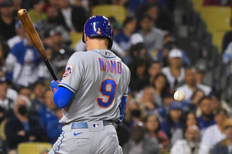 New York Mets' Brandon Nimmo is hit by a pitch thrown by Los Angeles Dodgers' Tyler Anderson during the sixth inning of a baseball game Friday, June 3, 2022, in Los Angeles.