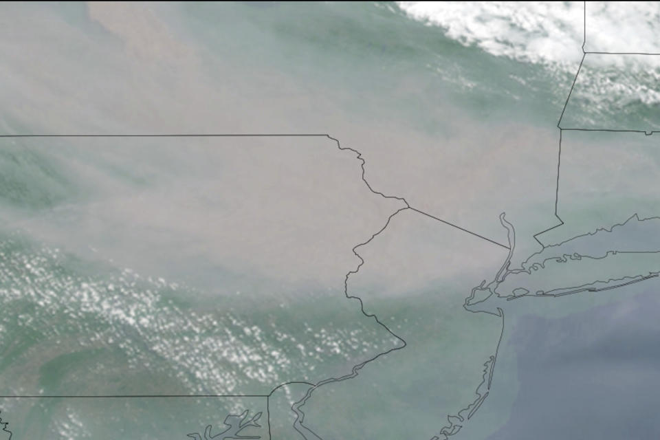 This GOES-16 GeoColor satellite image taken Wednesday, June 7, 2023, at 11:23 a.m. EDT and provided by CSU/CIRA & NOAA shows smoke from Canadian wildfires drifting across parts of New York, New Jersey and Pennsylvania. (CSU/CIRA & NOAA via AP)