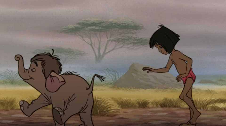 Mowgli following a baby elephant