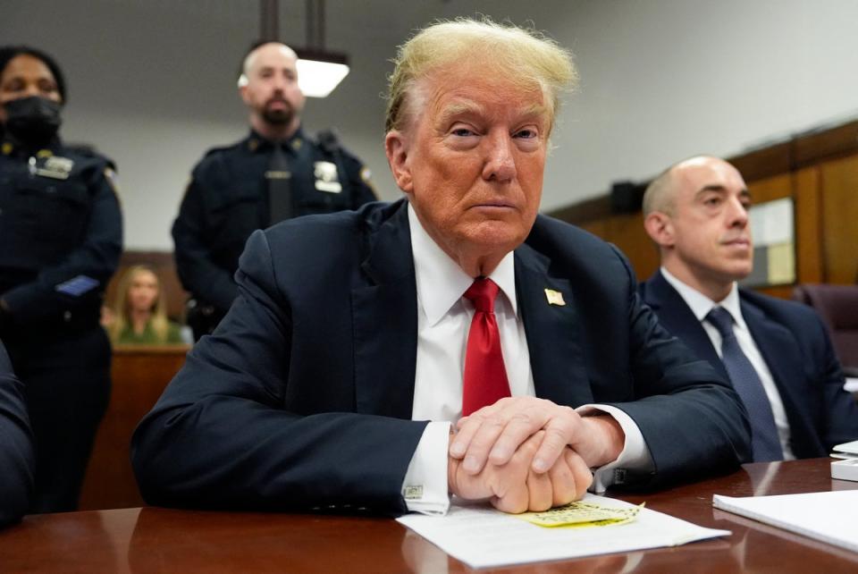 Trump waiting for court proceedings to start on Tuesday (POOL/AFP via Getty)