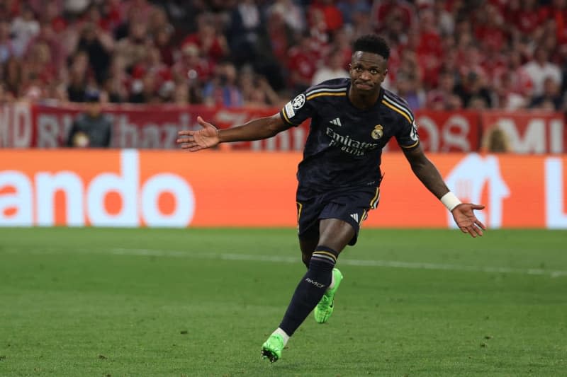 Real Madrid's Vinicius Junior celebrates scoring his side's second goal during the UEFA Champions League semi-final first leg soccer match between Bayern Munich and Real Madrid at Allianz Arena. Matthias Balk/dpa