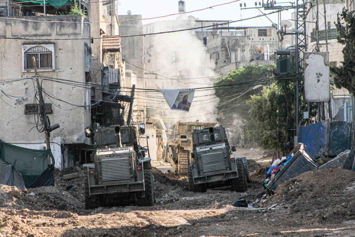 JENIN, WEST BANK, PALESTINE - 2024/09/02: Israeli military bulldozers destroy streets and shops in the market during a raid on the city of Tulkarm in the northern occupied West Bank. (Photo by Nasser Ishtayeh/SOPA Images/LightRocket via Getty Images)