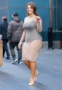 <p>Lampshading has been one of the hottest street style trends of the year, but Ashley Graham's take on it brings her pantsless-ness to new polka dotted extremes, layering a sheer dress over a black bodysuit and tossing in an optical illusion just for good measure.</p>