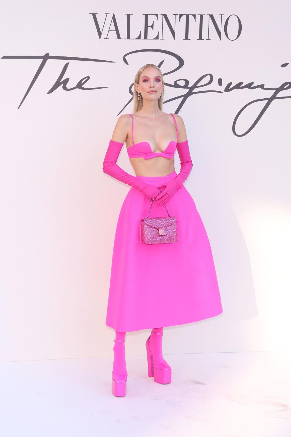 Leonie Hanne in pink at the Valentino Haute Couture Fall/Winter 22/23 fashion show.