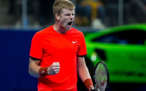 Kyle Edmund celebrates after winning his tennis match against France's Gael Monfils in the final of the 'European Open'  - Credit: AFP