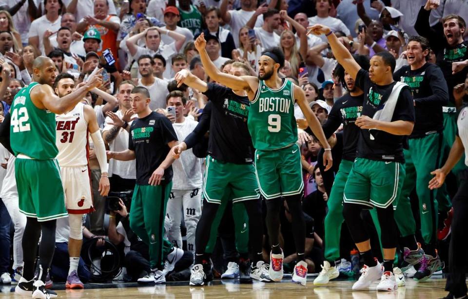 Boston Celtics guard Derrick White (9) reacts after the scoring game winning basket against the Miami Heat in Game 6 of the Eastern Conference finals at the Kaseya Center in Miami on Saturday, May 27, 2023.