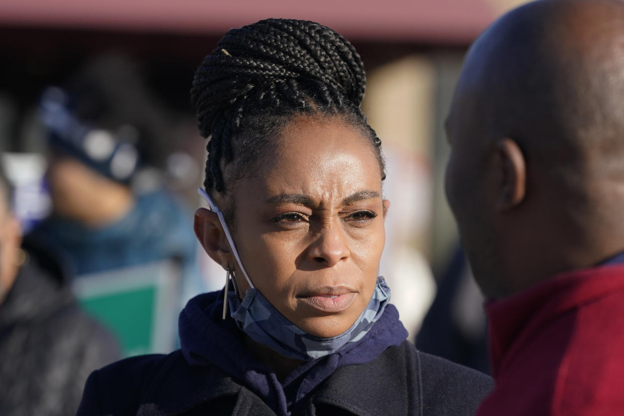 Democratic candidate Shontel Brown talks with a man at the Bedford Community Center, Tuesday, Nov. 2, 2021, in Bedford Heights, Ohio. Brown is running for Ohio's 11th Congressional District. (AP Photo/Tony Dejak)