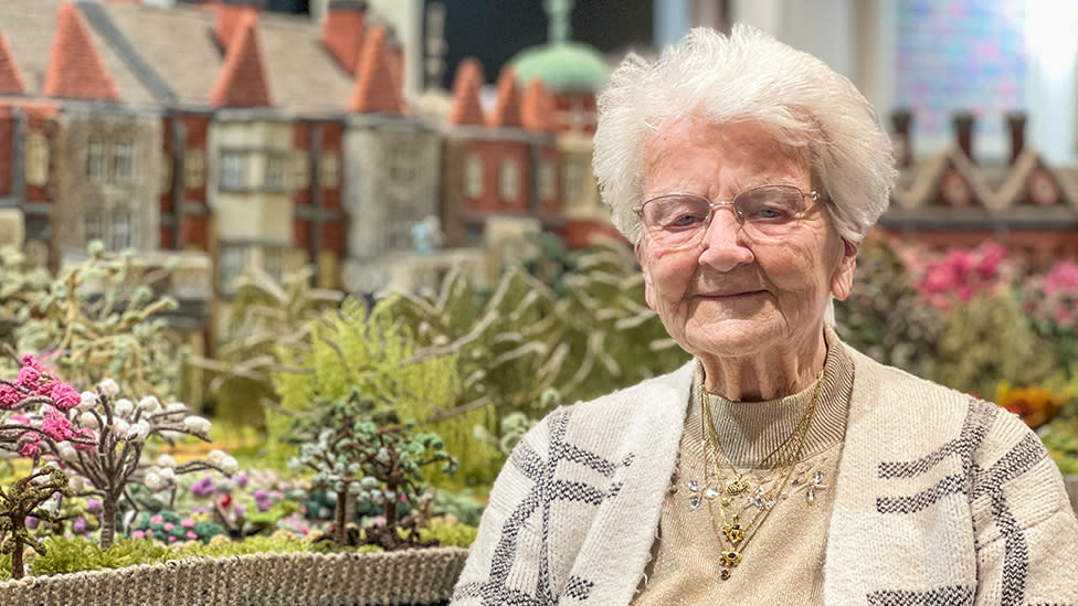 Margaret Seaman by her knitted Sandringham Estate