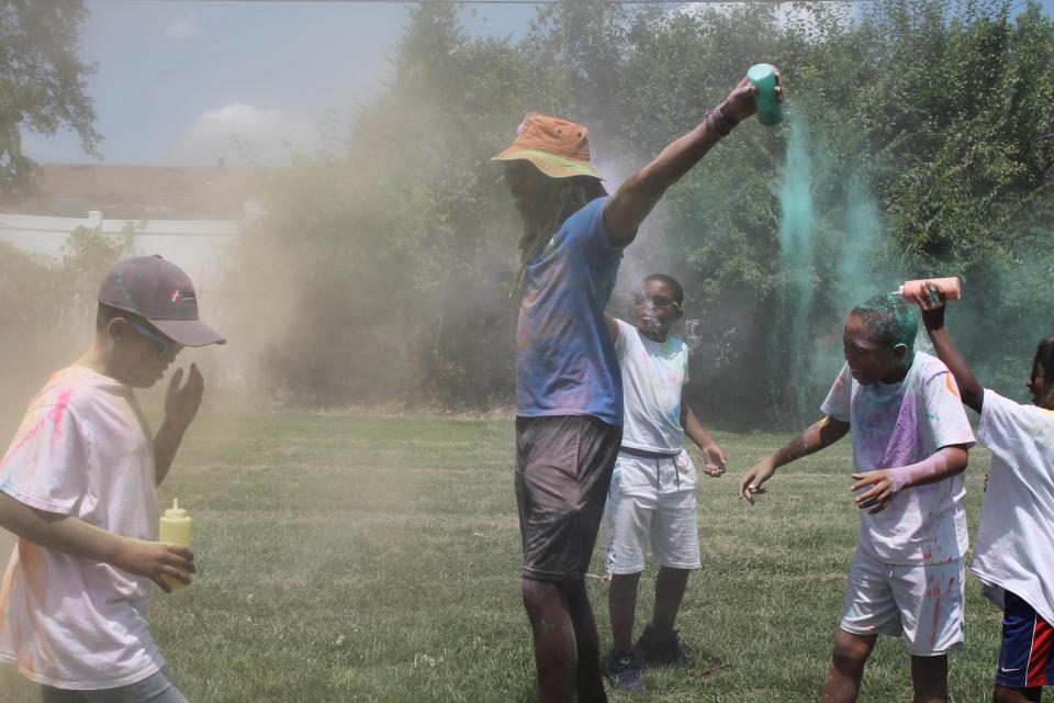 Columbus Recreation and Parks summer campers get colorfully competitive during a paint fight.