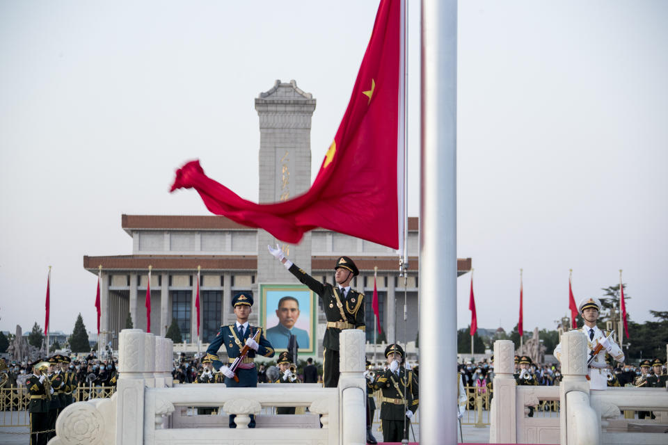 BEIJING, CHINA - MAY 01: The Guard of Honor of the Chinese People's Liberation Army (PLA) perform a flag-raising ceremony at the Tian'anmen Square to celebrate the International Labor Day on May 1, 2022 in Beijing, China. The International Labor Day is celebrated on May 1. The five-day Labor Day holiday, also known as May Day holiday, began on Saturday. (Photo by VCG/VCG via Getty Images)