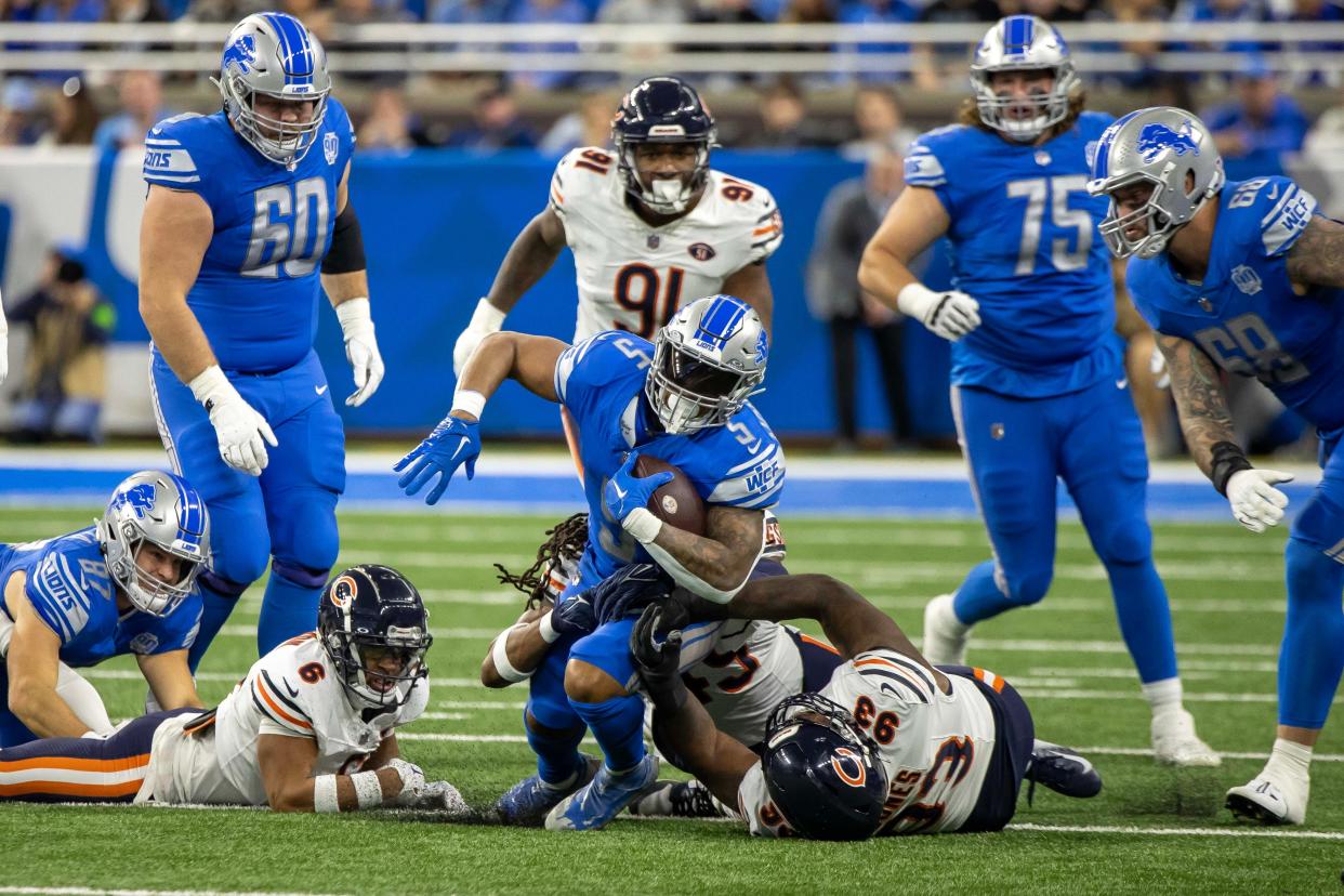 Detroit Lions running back David Montgomery (5) runs with the ball against the Chicago Bears during the first half at Ford Field.