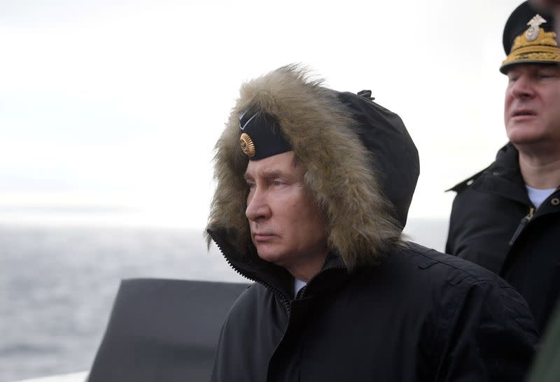 Russian President Vladimir Putin attends the joint drills of the Northern and Black sea fleets on board the Russian guided missile cruiser Marshal Ustinov in the Black Sea