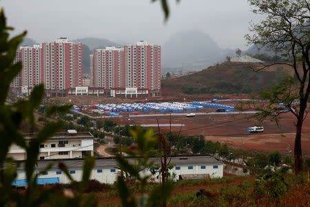 Chinese disaster relief tents housing refugees who fled fighting in neighbouring Myanmar are pitched in the town of Nansan, Yunnan province, China, March 12, 2017. REUTERS/Thomas Peter