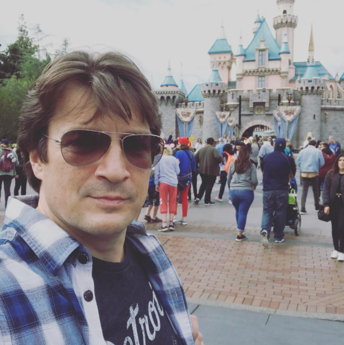 <p>A trip to Disneyland provided the former <em>Castle</em> star with the perfect opportunity to stategically pose and make this joke: “So… much… castle…” (Photo: <a rel="nofollow noopener" href="https://www.instagram.com/p/BT0PoOtALjE/" target="_blank" data-ylk="slk:Nathan Fillion via Instagram;elm:context_link;itc:0;sec:content-canvas" class="link ">Nathan Fillion via Instagram</a>) </p>