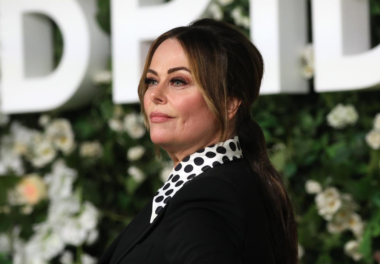 Actress Polly Walker at the "Bridgerton" season 2 premiere in a black top with a polka dot collar