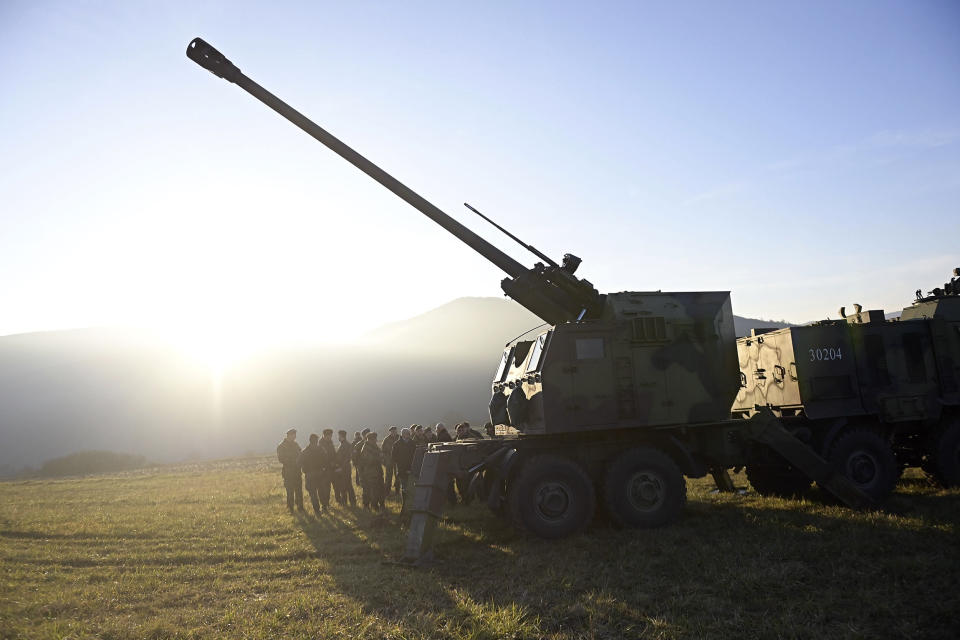 In this photo provided by the Serbian Defense Ministry Press Service, Serbian army self-propelled 155 mm gun-howitzers are seen on position near administrative line with Kosovo, south Serbia, Monday, Dec. 26, 2022. Kosovo remains a potential flashpoint in the Balkans years after the 1998-99 war that ended with NATO intervention. Serbia doesn't recognize the 2008 declaration of independence of its former province, while Western efforts to mediate a solution so far have failed. (Serbian Defense Ministry Press Service via AP)