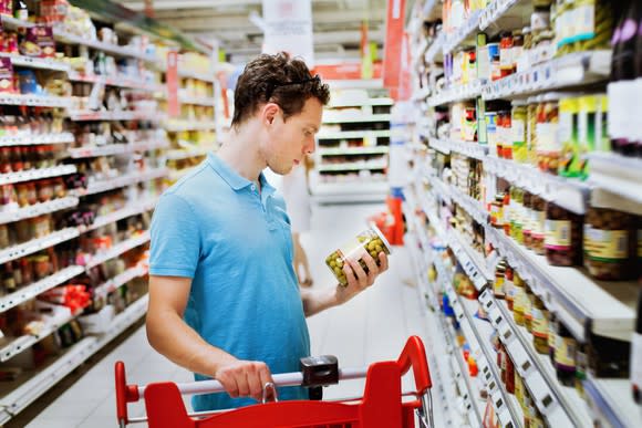 A shopper buys groceries.