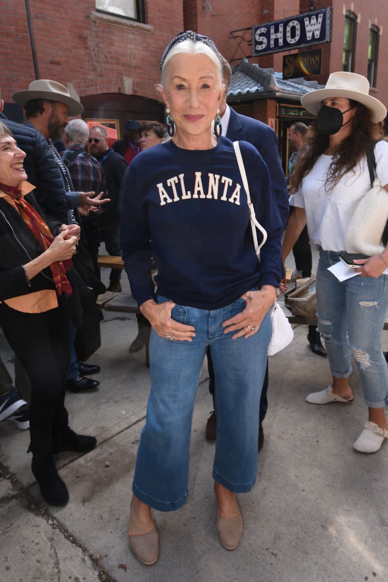 <p> We know she always looks gorgeous on the red carpet, but this outfit proves Helen Mirren does street style flawlessly too. A great casual outfit idea for women over 50, sporting cropped jeans, and a relaxed navy spell-out crewneck, she proves that style and comfort can go hand-in-hand.  </p>
