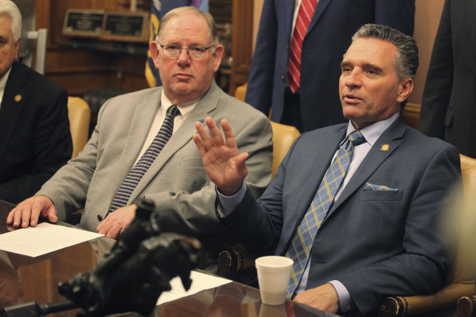 Kansas Senate President Ty Masterson, right, R-Andover, speaks during a news conference with other Republican leaders, with House Speaker Dan Hawkins, left, R-Wichita, watching, following the Legislature's adjournment of its annual session, Wednesday, May 1, 2024, at the Statehouse in Topeka, Kan. Some lawmakers hope to lure the Kansas City Chiefs and Kansas City Royals to Kansas with a plan to help them finance new stadiums. (AP Photo/John Hanna)