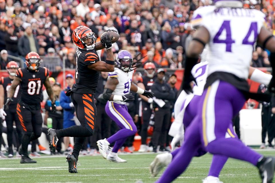 Cincinnati Bengals wide receiver Ja'Marr Chase (1) completes a catch in the third quarter of a Week 15 NFL football game between the Minnesota Vikings and the Cincinnati Bengals, Saturday, Dec. 16, 2023, at Paycor Stadium in Cincinnati. The Cincinnati Bengals won 27-24 in overtime.