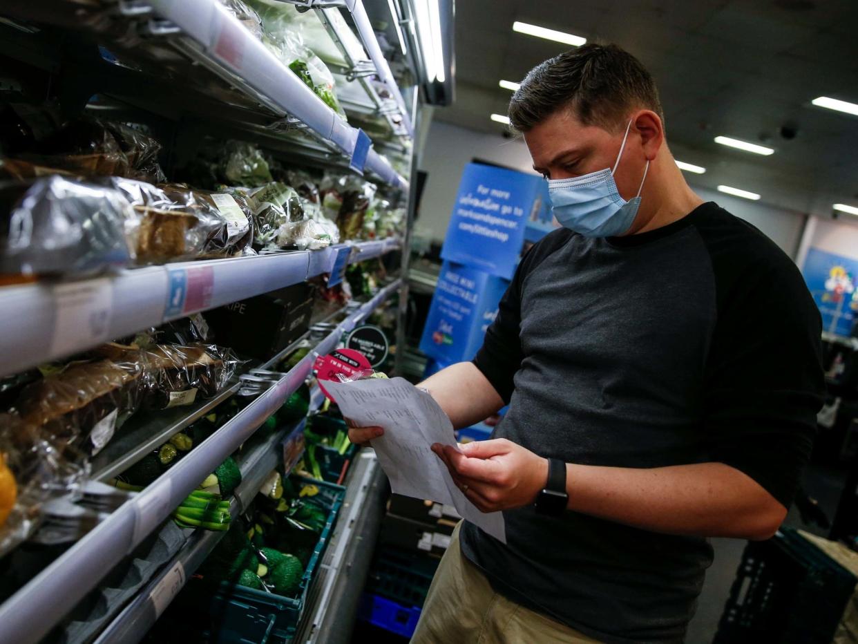 A customer wears a face mask while shopping at a M&S in Islington on July 11, 2020 in London, England: Getty Images