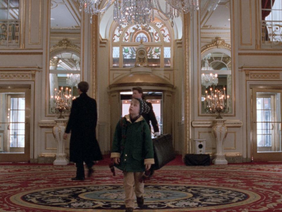 kevin looking around the lobby of the plaza hotel in home alone 2
