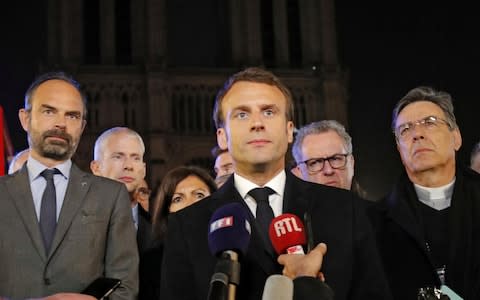 Emmanuel Macron was targeted by conspiracy theorists following the blaze - Credit: Philippe Wojazer/Reuters