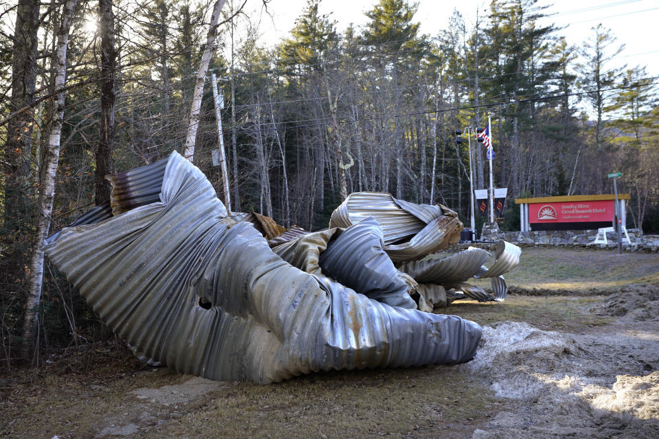 A mangled culvert sits near the road to Sunday River ski resort's Grand Summit Hotel following this week's disastrous rainstorm, Thursday, Dec. 21, 2023, in Newry, Maine. (AP Photo/Robert F. Bukaty)