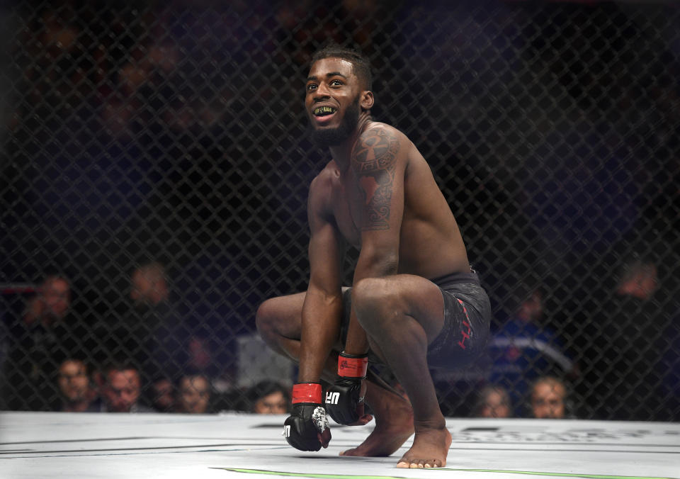 Devonte Smith of the U.S., celebrates after defeating South Korea's Dong Hyun Ma during their lightweight bout at the UFC 234 event in Melbourne, Australia, Sunday, Feb. 10, 2019. (AP Photo/Andy Brownbill)