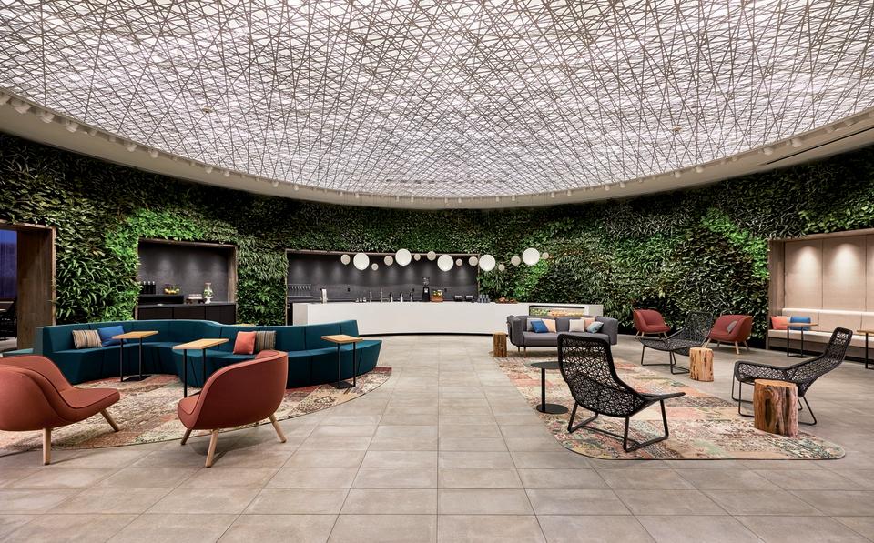 At 4 Times Square in New York, the starchitect-designed space has had its signature curves tuned up and opens onto a new garden room