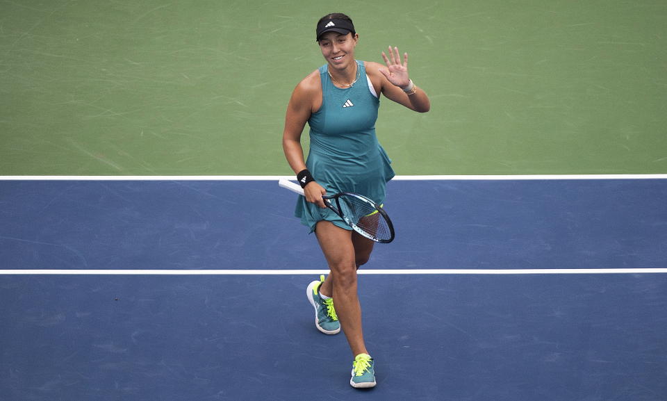 Jessica Pegula, from the United States, salutes the crowd following her win in the women's final of the National Bank Open tennis tournament against Liudmila Samsonova, from Russia, in Montreal, Sunday, Aug. 13, 2023. (Graham Hughes/The Canadian Press via AP)