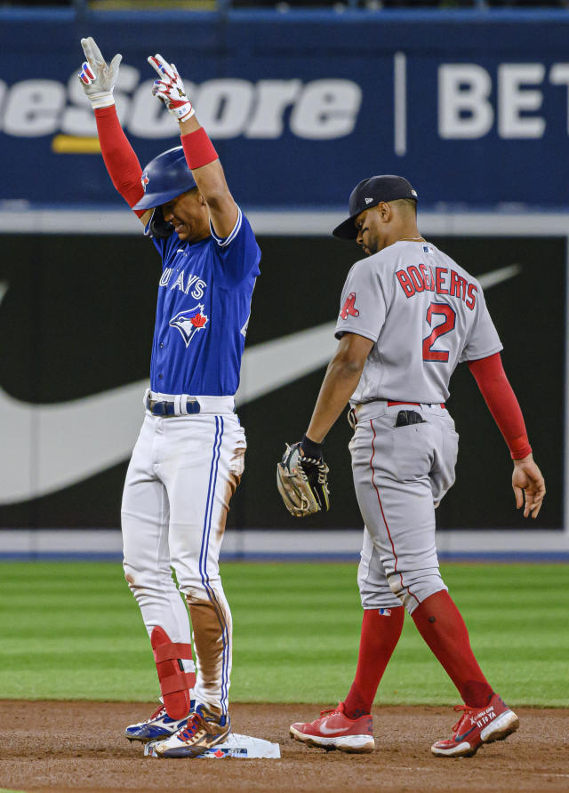 Gosuke Katoh of the Toronto Blue Jays in the dugout ahead of their