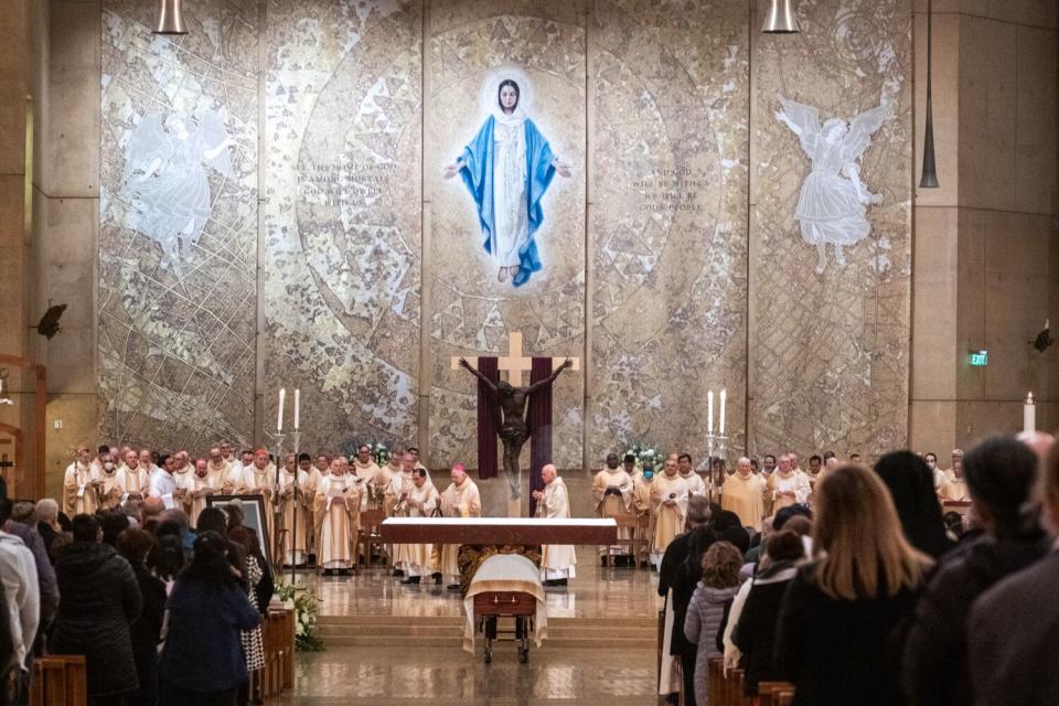 People gather at the Cathedral of Our Lady of the Angels for a vigil Mass