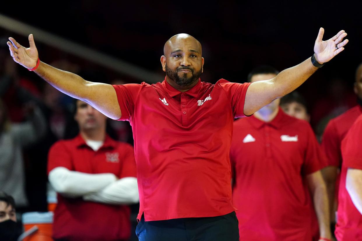 Miami RedHawks head coach Jack Owens pumps up the crowd during free throws in the second half of an NCAA men's college basketball game, Wednesday, Dec. 1, 2021, at Millett Hall in Oxford, Ohio. The Cincinnati Bearcats won, 59-58.