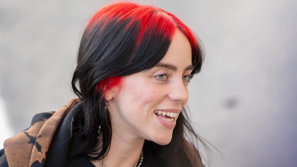 Billie Eilish, too, is another A-lister whose hair is strikingly scarlet. - RB/Bauer-Griffin/GC Images/Getty Images