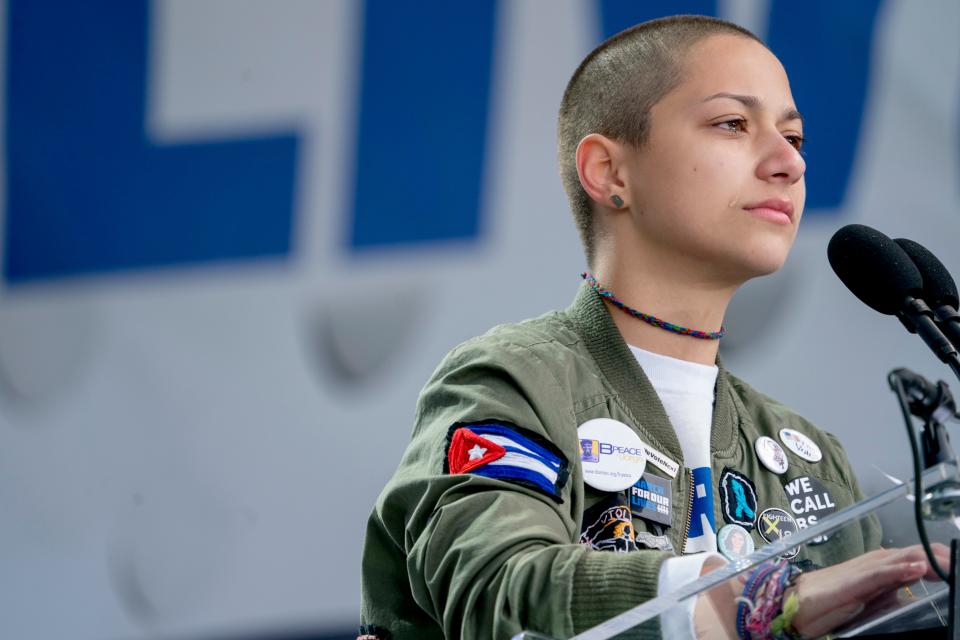 Emma Gonzalez, who now goes by X Gonzalez, a survivor of the mass shooting at Marjory Stoneman Douglas High School in Parkland, Fla., closes their eyes and cries as they stand silently at the podium for the amount of time it took the Parkland shooter to go on his killing spree during the "March for Our Lives" rally in support of gun control in Washington on March 24, 2018.