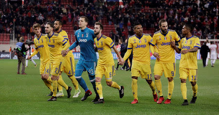 Soccer Football - Champions League - Olympiacos vs Juventus - Karaiskakis Stadium, Piraeus, Greece - December 5, 2017 Juventus players celebrate after the match REUTERS/Costas Baltas