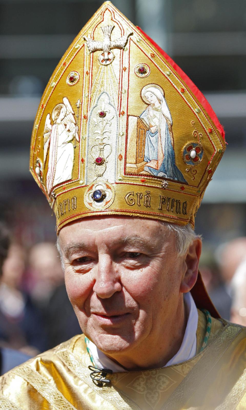 FILE - In this May 21, 2009 file photo, new Catholic Archbishop of Westminster, Vincent Nichols, meets devotees outside Westminster Cathedral in London after a service to install him as the 11th Archbishop. Nichols is amongst the 19 new cardinals that Pope Francis announced Sunday, Jan. 12, 2014 during his Angelus prayer from his studio window overlooking St. Peter's Square. The ceremony to formally install them as cardinals will be held Feb. 22 at the Vatican. (AP Photo/Sang Tan, files)