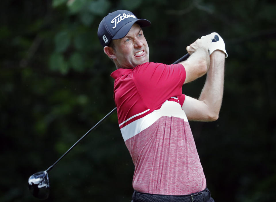 Webb Simpson hits his tee shot on the second hole during the third round of the Wyndham Championship golf tournament at Sedgefield Country Club in Greensboro, N.C. Saturday, Aug. 3, 2019. (AP Photo/Chris Seward)