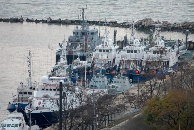 Seized Ukrainian naval ships are towed by Russia's Coast Guard vessels out of the port in Kerch