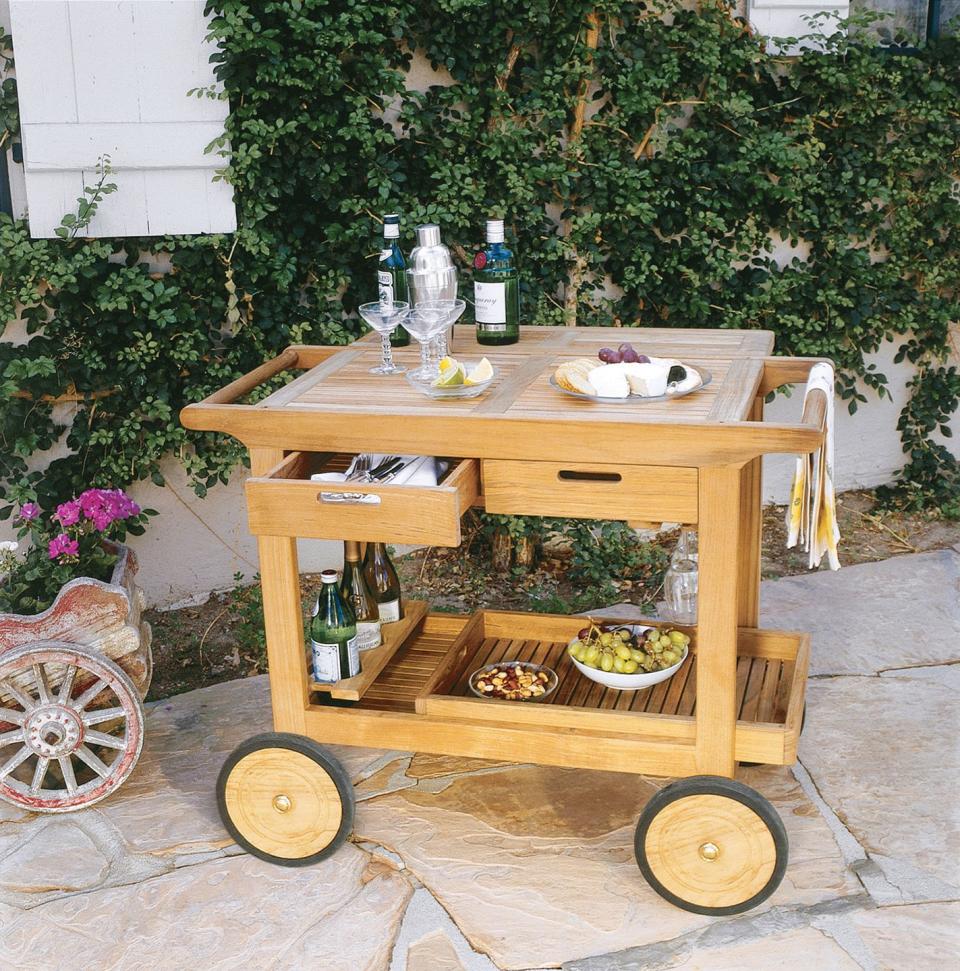 <p>Elevate your outdoor area with a wooden bar cart with all the right fixings for entertaining.</p>