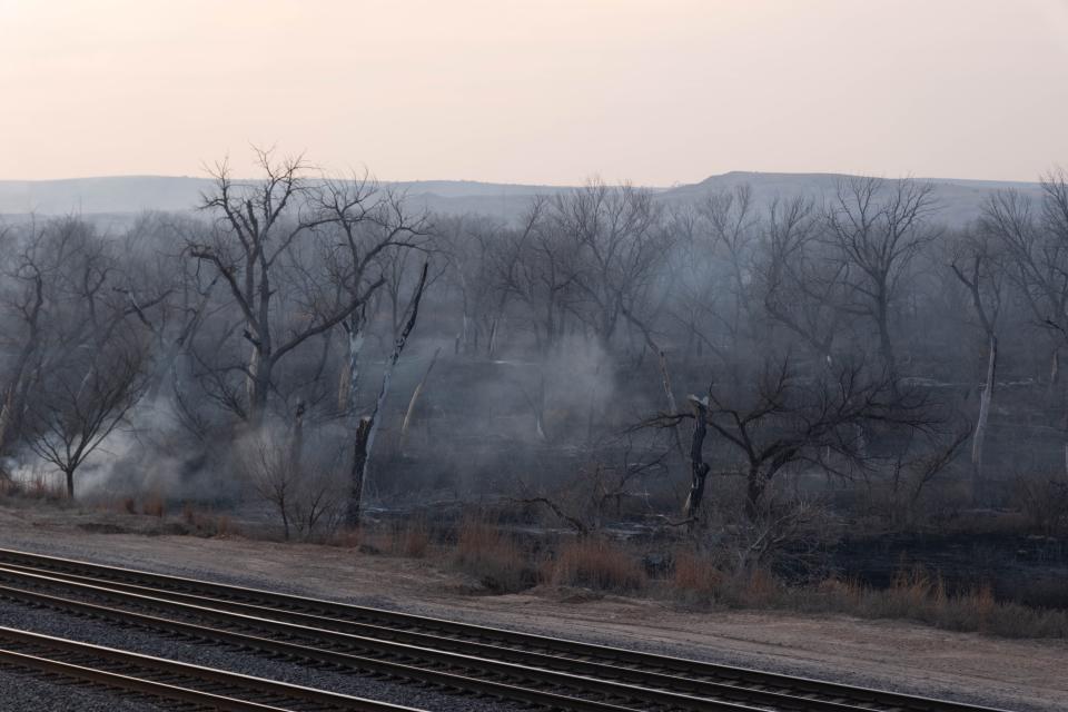 Area near Highway 60 in Roberts County still smoldering Wednesday from the Smokehouse Creek Fire.