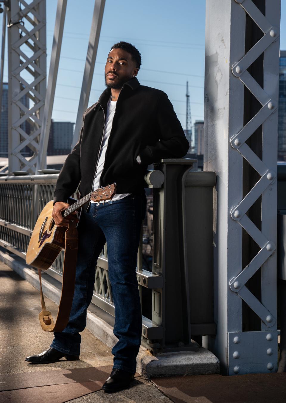 Country musician Tony Evans Jr. poses for a portrait on the John Seigenthaler Pedestrian Bridge in Nashville, Tenn., Friday, Jan. 27, 2023.