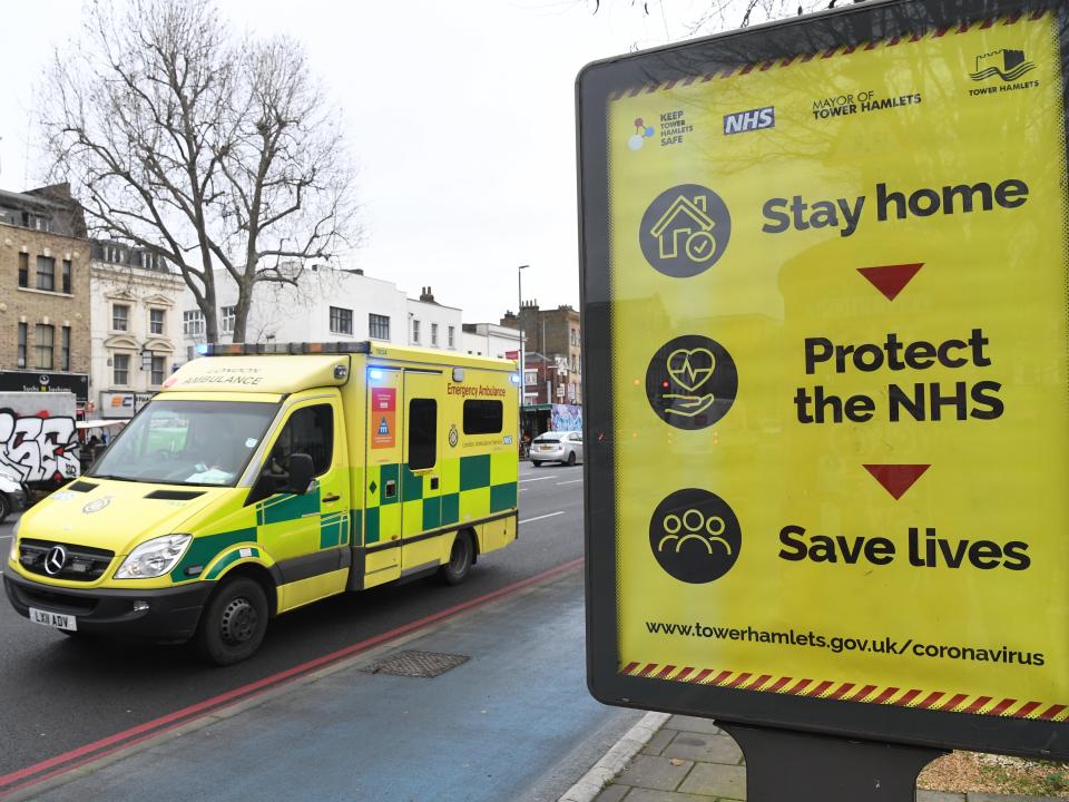 <p>An ambulance drives past near the Royal London hospital in London, as the NHS continues to be under pressure over a sharp increase in hospital admissions in the country</p> (EPA)