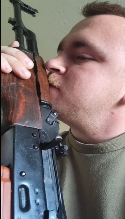 A screenshot from a video Thomas DeVelin posted of himself sniffing a gun and saying, "This one smells like dead Jews," according to a court document filed in U.S. District Court by an agent with the U.S. Bureau of Alcohol, Tobacco, Firearms and Explosives.