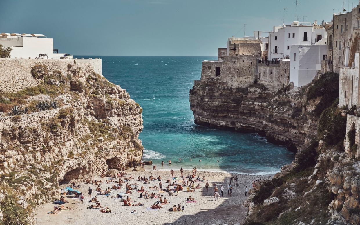 Puglia beach, Italy, cliff, coastal, cove, day, destination, group of people, horizon over water, ocean, outdoors, rocky, rugged, shore, summer, travel - JASON IERACE/27