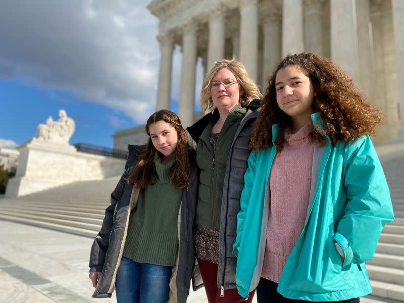 FILE PHOTO: Montana resident Kendra Espinoza, a key plaintiff in a major religious rights case to be argued before the U.S. Supreme Court, poses in front of the building in Washington