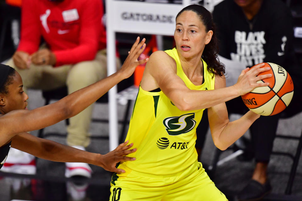 PALMETTO, FLORIDA - OCTOBER 02: Sue Bird #10 of the Seattle Storm looks to pass the ball around Lindsay Allen #15 of the Las Vegas Aces during the first half of Game 1 of the WNBA Finals at Feld Entertainment Center on October 02, 2020 in Palmetto, Florida. NOTE TO USER: User expressly acknowledges and agrees that, by downloading and or using this photograph, User is consenting to the terms and conditions of the Getty Images License Agreement. (Photo by Julio Aguilar/Getty Images)