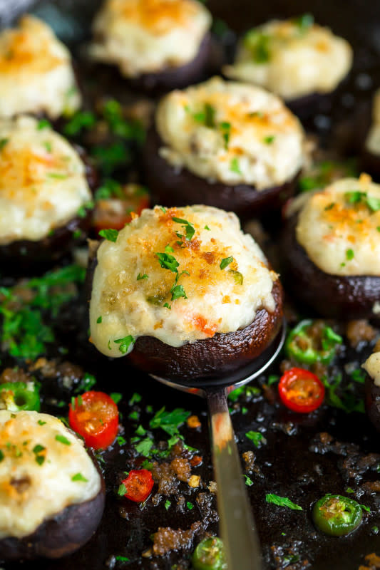 <p>Peas and Crayons</p><p>These tender stuffed mushroom caps are filled to the brim with cream cheese, garlic, white cheddar and jalapeño goodness and topped with an optional sprinkle of crispy panko breadcrumbs. Can be made ahead of time too!</p><p><a href="https://peasandcrayons.com/2018/11/jalapeno-cream-cheese-stuffed-mushrooms.html" rel="nofollow noopener" target="_blank" data-ylk="slk:Get the Recipe;elm:context_link;itc:0;sec:content-canvas" class="link ">Get the Recipe</a></p>